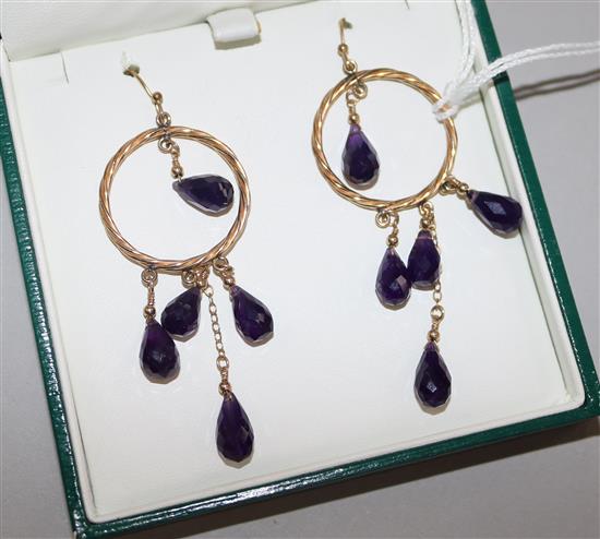 A pair of gold and amethyst pendant earrings
